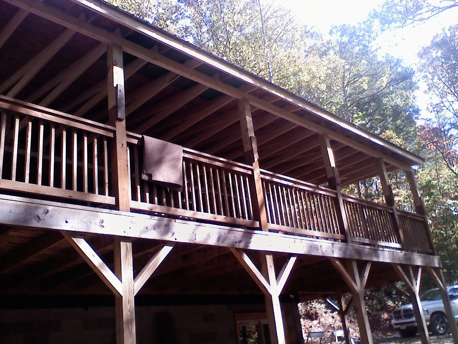 Timber framing under a new elevated porch and deck — Roof Leak Repair in Basin by Roofing Brothers